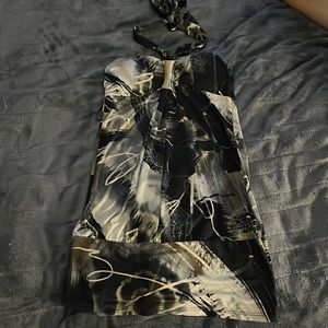 Y2K vibes. Soft shirt with neck bow tie and silver decor on chest.